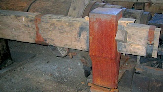 A large wooden power hammer
